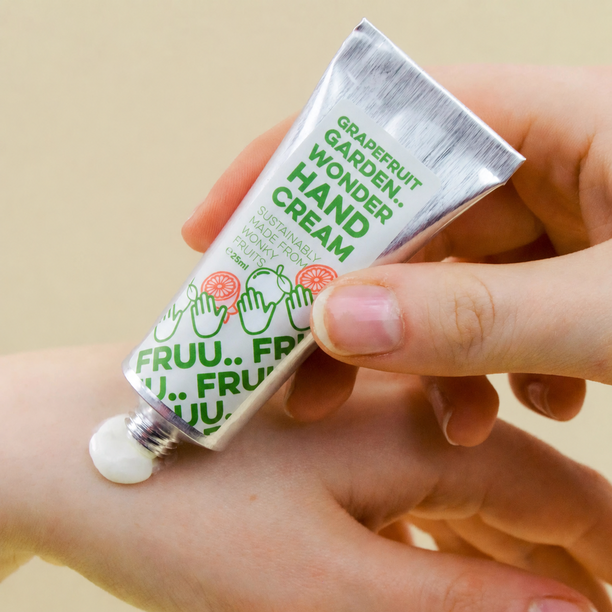 Grapefruit Garden Wonder Hand Cream being applied to a hand